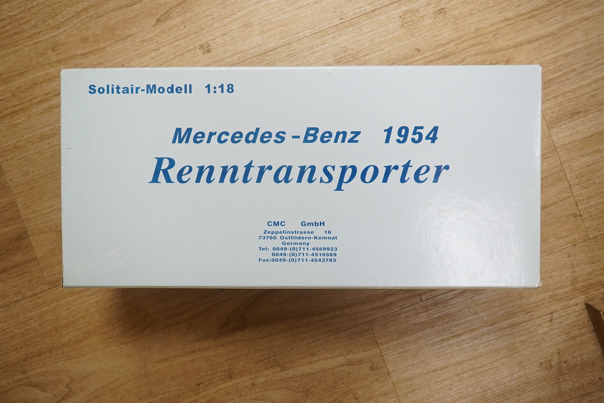 A boxed CMC 1:18 scale diecast model of a Mercedes-Benz 1954 racing car transporter. Condition - good.